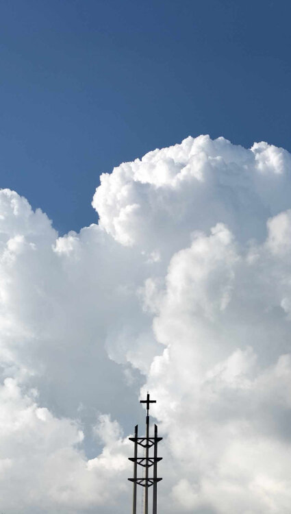 abbey bell tower against clouds